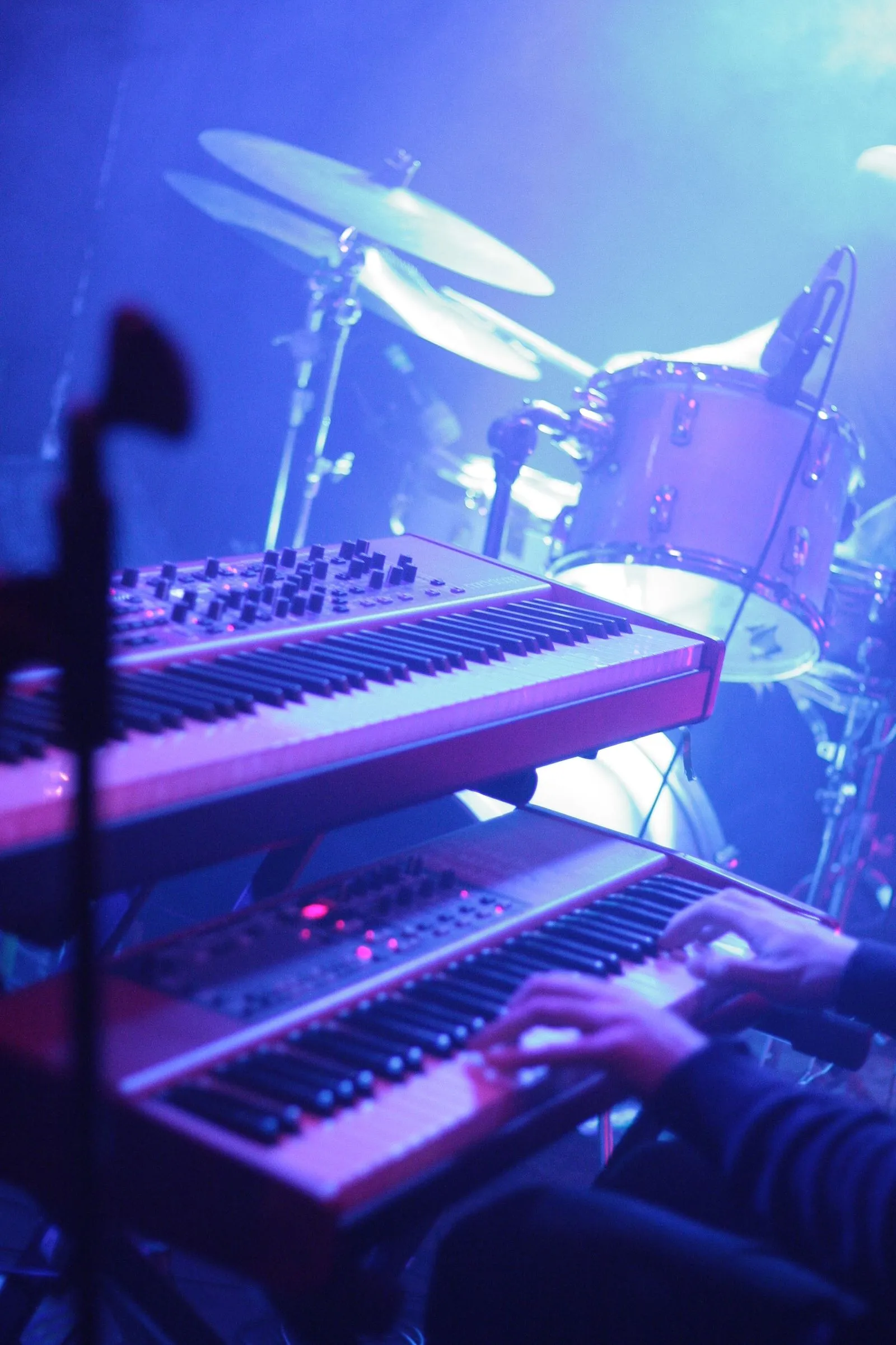 close-up to two keyboards on stage